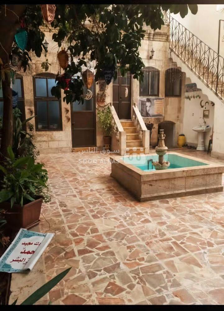 دار عربي ٥ غرف وقبو دكان مرخص طابو وبركة ماء وجب  الدار طابقيز